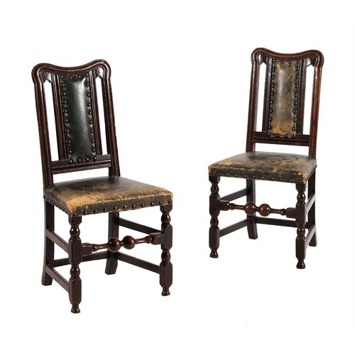 675 - A pair of oak and green leather upholstered side chairs, early 18th century and later, each 100cm hi... 