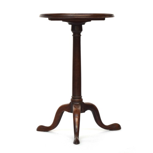 620 - A Regency mahogany tripod table, the circular dished top on gun barrel column and cabriole legs with... 