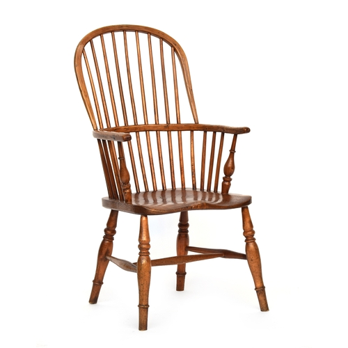 667 - A yew and elm high back Windsor chair, probably Lincolnshire first half 19th century, spindle back, ... 