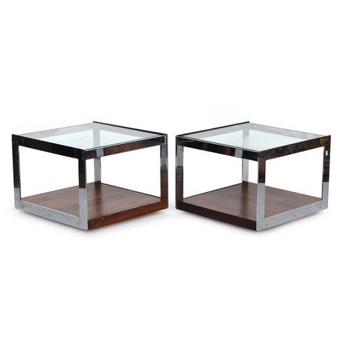 695 - A pair of Merrow Associates rosewood and chrome plated two tier coffee tables, each with glass inset... 