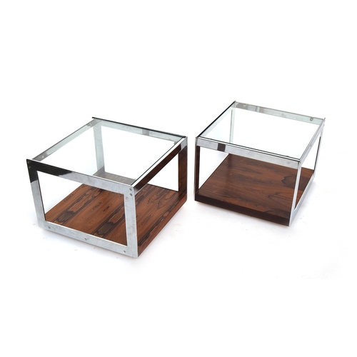 695 - A pair of Merrow Associates rosewood and chrome plated two tier coffee tables, each with glass inset... 