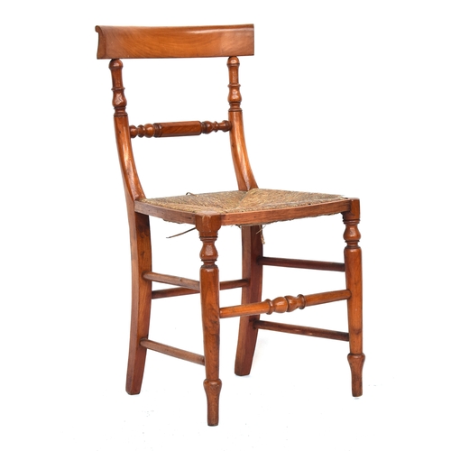 654 - A set of six 19th century satin-birch dining chairs, the curved rail over a faceted turned mid-rail,... 