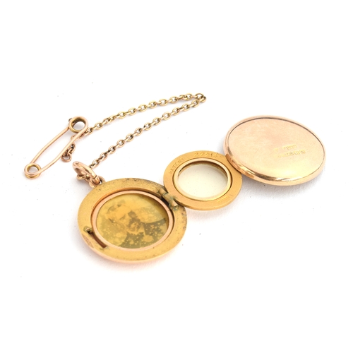 53 - A Victorian 15ct gold locket, patented tri-fold mechanism, with safety chain, 10.7g