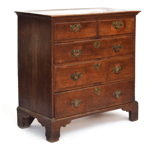 593 - A George II oak chest of drawers, the moulded top above two short and three graduating drawers with ... 