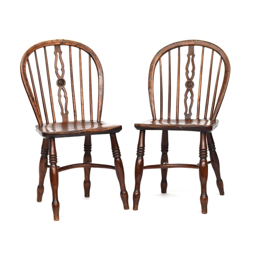 665 - A pair of yew and elm Windsor side chairs, attributed to the Prior Family workshop, narrow pierced a... 