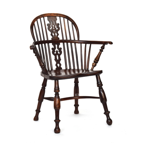 668 - A yew and elm Windsor chair pierced splat back, the yew arm bow set unusually wide on turned front s... 