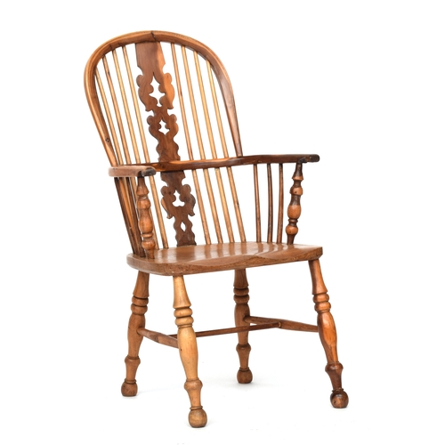 670 - A light yew and elm splat back Windsor chair, probably Lincolnshire, turned front arm supports, sadd... 