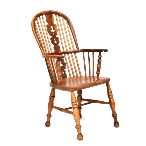 670 - A light yew and elm splat back Windsor chair, probably Lincolnshire, turned front arm supports, sadd... 