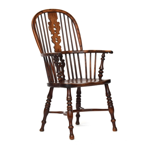 671 - A yew and elm splat back Windsor chair, probably Lincolnshire, turned front arm supports, the saddle... 