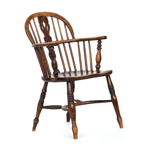 673 - A splat back Windsor chair, turned front arm supports, the elm saddle seat raised on ring turned leg... 