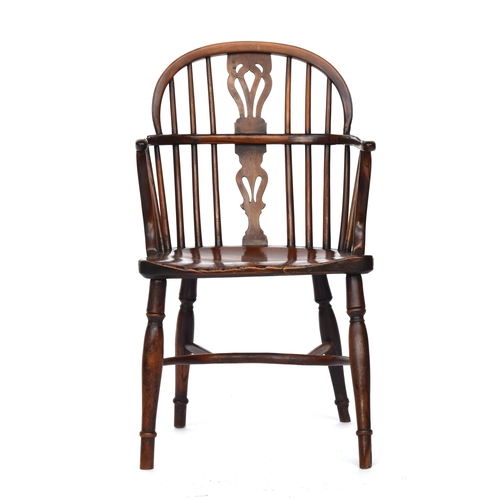 674 - A yew and elm Windsor chair, pierced splat, the elm saddle seat raised on baluster turned legs joine... 