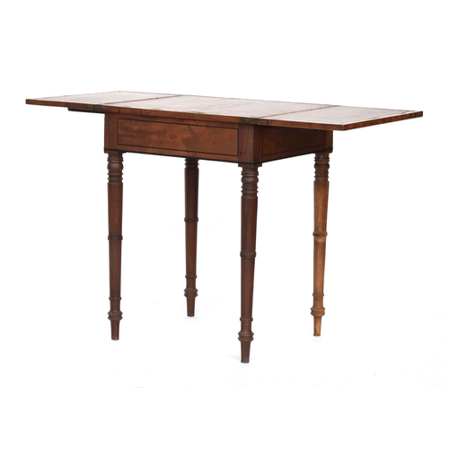 634 - A Regency mahogany and ebony strung occasional games table, c.1830, fold out top, on ring turned tap... 