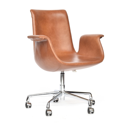 705 - A leather upholstered swivel chair on chrome base, in the style of the Tulip chair by Preben Fabrici... 