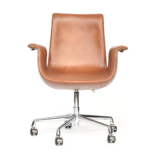 705 - A leather upholstered swivel chair on chrome base, in the style of the Tulip chair by Preben Fabrici... 