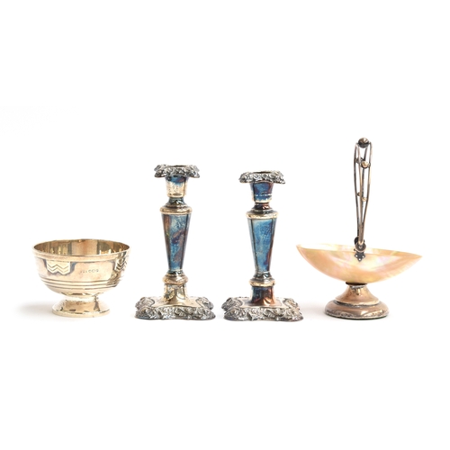 202 - A small pair of loaded silver candlesticks, tapered and chased, 13cm high; together with a small sil... 