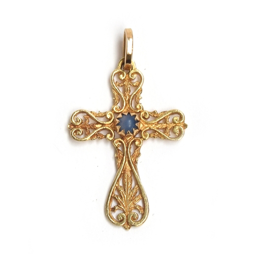 61 - An 18ct gold pierced crucifix set with a central blue stone, 3.2cm long, 3g