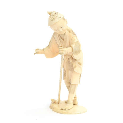 248 - A Japanese Meiji era okimono of an elderly man holding a walking stick, signature to base, 14cm high