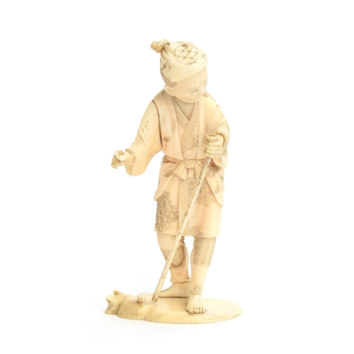 248 - A Japanese Meiji era okimono of an elderly man holding a walking stick, signature to base, 14cm high