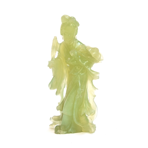 263 - A Chinese carved jade figure of Guanyin, the Bodhisattva of compassion, 19cm high