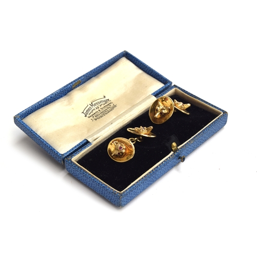 63 - A pair of 9ct gold fox mask cufflinks, each set with ruby eyes, approx. 18.4g