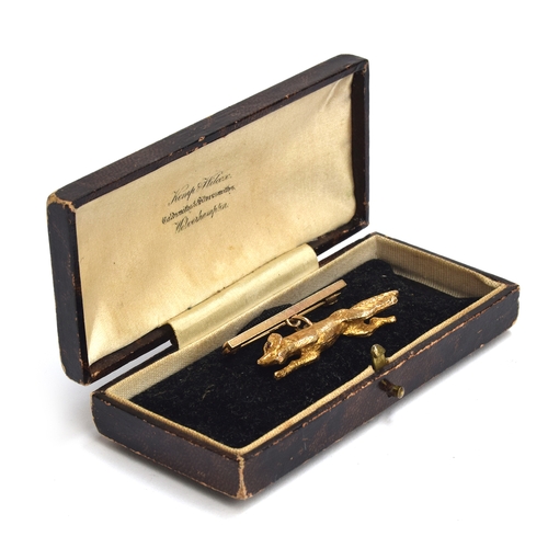 34 - A 9ct gold bar brooch in the form of a running fox, 4.5cm long, approx. 13.5g