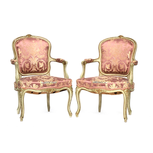 659 - A pair of late 19th century Louis XV style painted and parcel gilt salon chairs