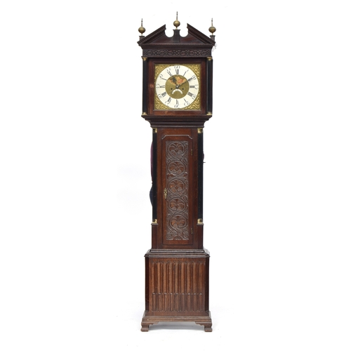 577 - An oak longcase clock, broken pediment over blind fretwork, the 12.5