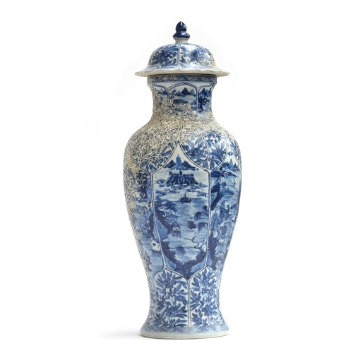 262 - A large Chinese blue and white urn, recovered from a shipwreck, with panels depicting flora and land... 