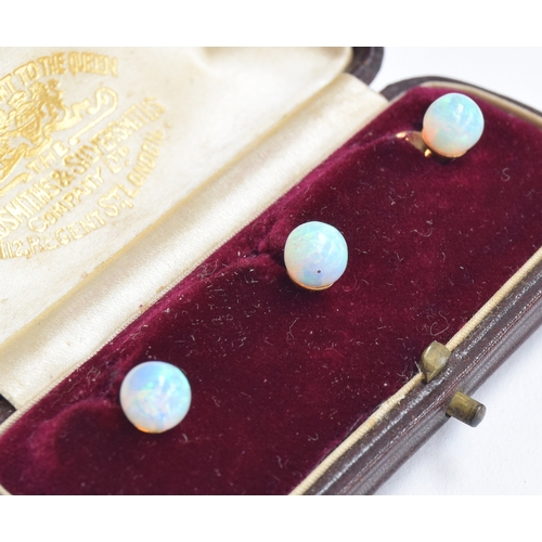 62 - A cased set of three opal and 14ct gold dress studs; together with a further cased pair of opal and ... 