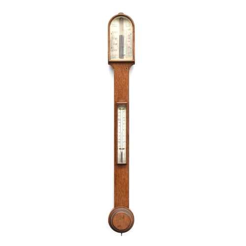 571 - A Negretti & Zambra oak cased aneroid stick barometer, with thermometer and vernier slide adjustor, ... 