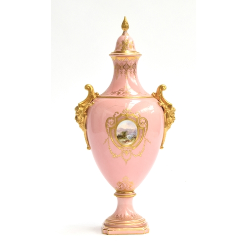 276 - An early 20th century Coalport lidded urn, pink ground heightened in gilt, with a hand painted panel... 