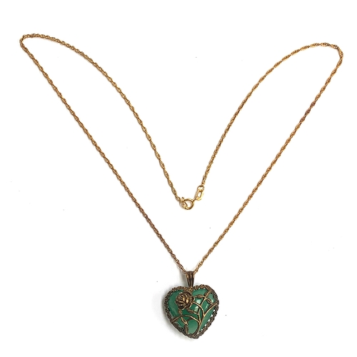 7 - A 9ct gold pendant in the form of an agate heart mounted in a floral cage, on a 9ct gold chain, appr... 