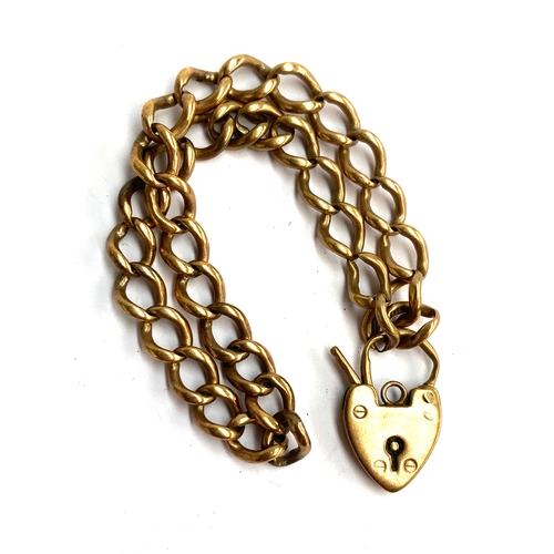 11 - A 9ct gold bracelet with heart padlock clasp, approx. 12g