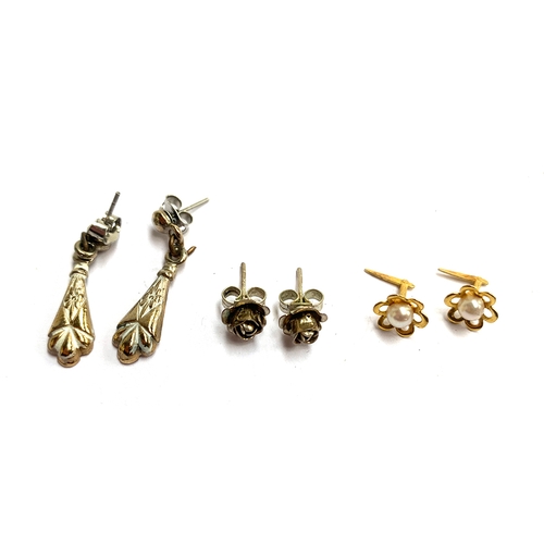 12 - Three pairs of earrings to include white metal roses, 9ct gold and pearl, and one other pair