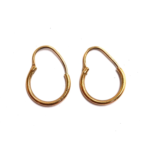 13 - 9ct gold hoop earrings, approx. 1g; together with three unmatched gold earrings, approx. 1.3g