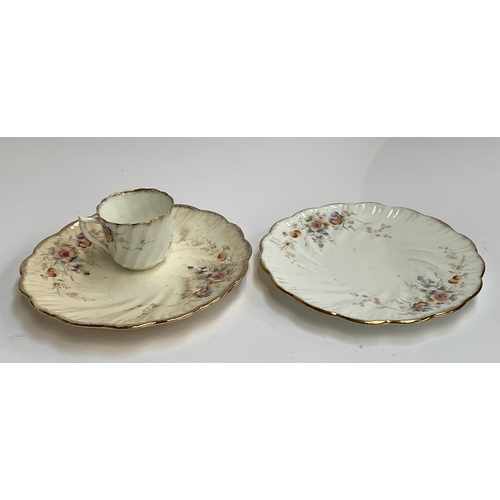 123 - A china tea set with floral decoration comprising cake plates (2), side plates (10), saucers (11), c... 