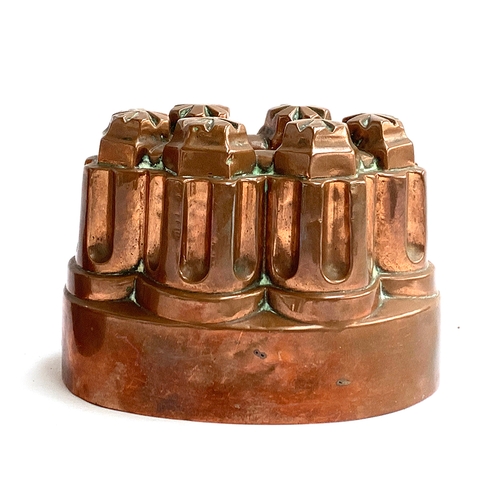 285 - A Victorian Benham & Froud copper jelly mould, of fluted turret form, shape no. 486, 15cmL