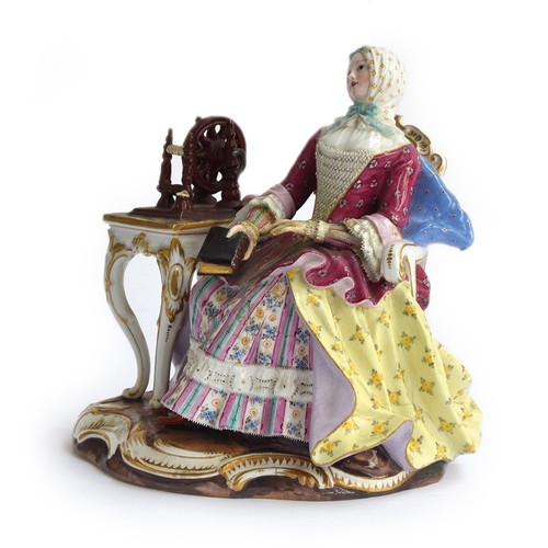 273 - A 19th century Meissen group of a seated lady at a spinning wheel, 'The Good Housekeeper' or 'Leseri... 