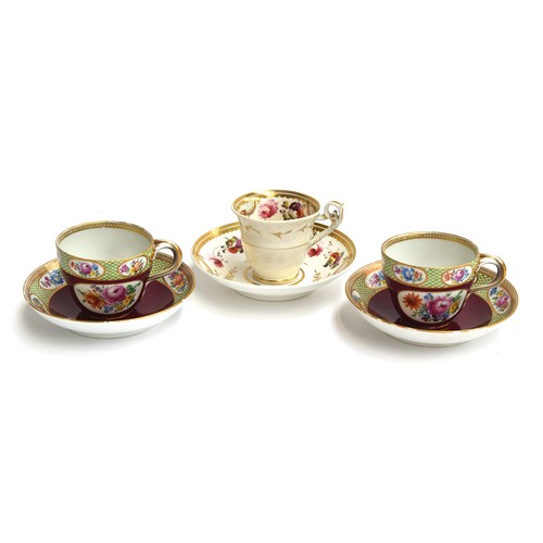 277 - A pair of Meissen teacups and saucers, burgundy ground with floral panel decoration, the rims with a... 