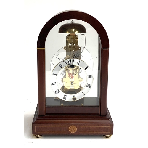 53 - A gilt metal skeleton clock, painted dial with Roman numerals, glass dome with key, 31cmH, together ... 