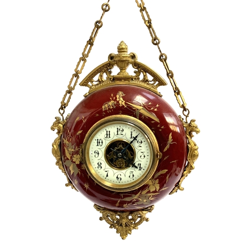 55 - A French toleware wall hanging clock, circa 1900, with ormolu mounts, enamel dial with Arabic numera... 