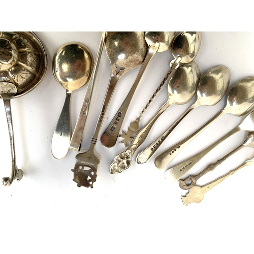 98 - A collection of silver spoons, to include a Georgian spoon, American 'Flat Iron Bloc', 'Little Boy B... 