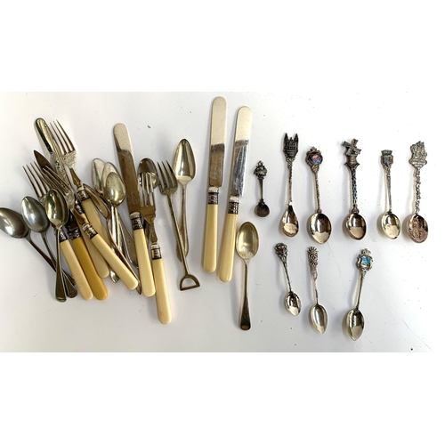 98 - A collection of silver spoons, to include a Georgian spoon, American 'Flat Iron Bloc', 'Little Boy B... 