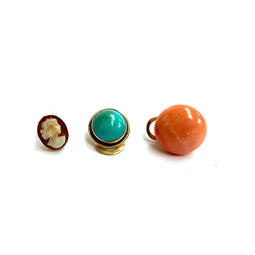 16 - Three single earrings: an 18ct gold and coral clip on earring; an 18ct gold and turquoise clip on ea... 