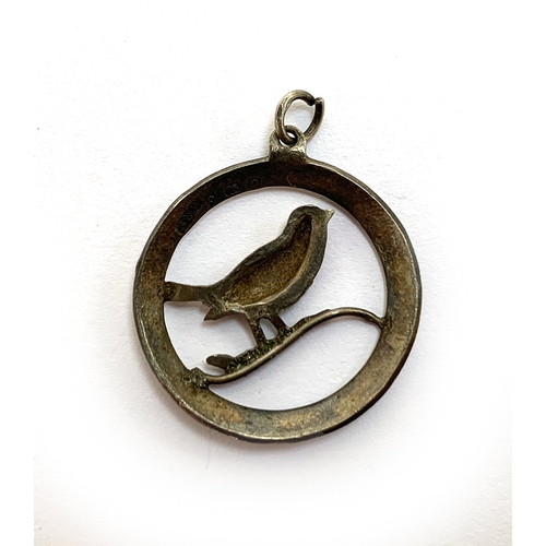 26 - A silver and enamel pendant in the form of a robin on a branch, hallmarked for Richard John Wakefiel... 