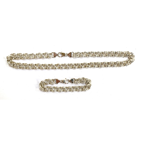 34 - A heavy 925 silver chain, hallmarked JM, can be worn as a long necklace, 65cm long, or a shorter nec... 