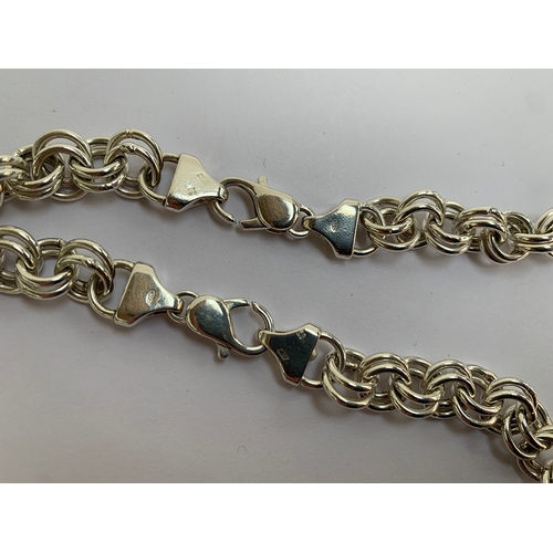 34 - A heavy 925 silver chain, hallmarked JM, can be worn as a long necklace, 65cm long, or a shorter nec... 