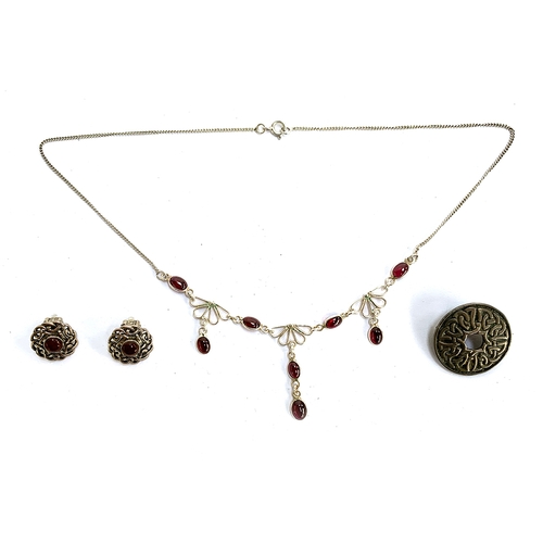 35 - A pretty 925 silver necklace set with red stones, together with a pair of sterling silver Celtic kno... 