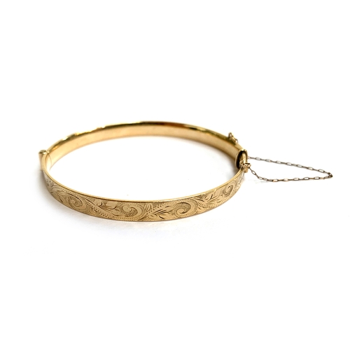 41 - A LW&G Lagarmic 9ct gold with bronze core bangle, foliate design, approx. 6.5cm wide, with safety ch... 