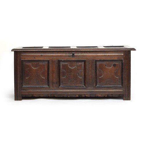 580A - A 17th century three panel oak coffer, 'dated' 1661, 131cm wide, 56cm deep, 55cm high